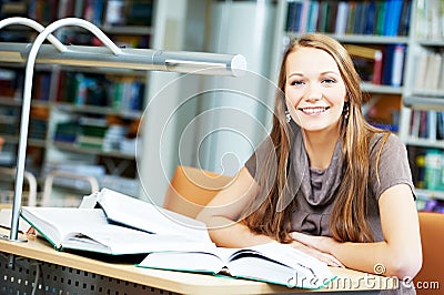 Young student girl study with book in library Stock Photo