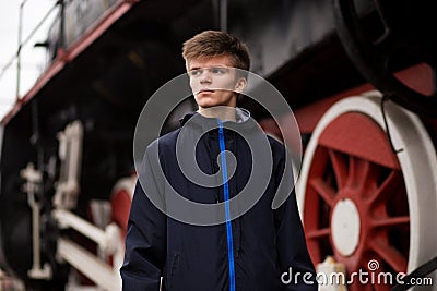 Young student man wait on Old Steam Train. future engineer technologist Stock Photo