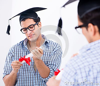 Young student planning graduation speech in front of mirror Stock Photo