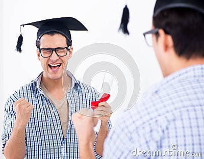 Young student planning graduation speech in front of mirror Stock Photo