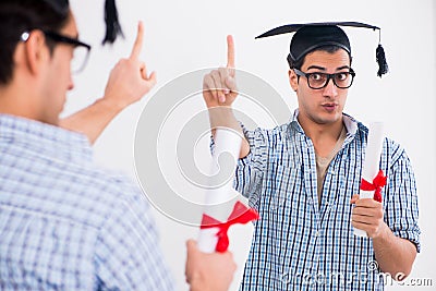 The young student planning graduation speech in front of mirror Stock Photo