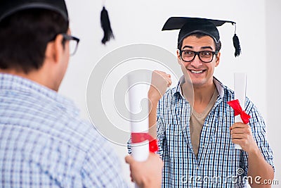 The young student planning graduation speech in front of mirror Stock Photo