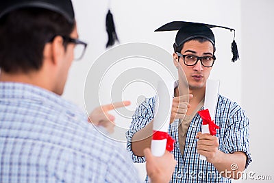 The young student planning graduation speech in front of mirror Stock Photo