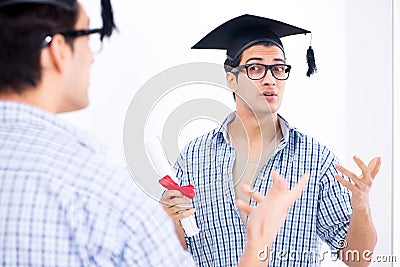 The young student planning graduation speech in front of mirror Stock Photo