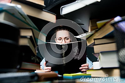 A young student is preparing for the session. The difficult period of exams Stock Photo