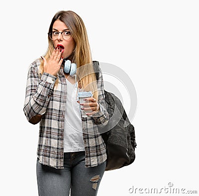Young student woman with headphones and backpack Stock Photo