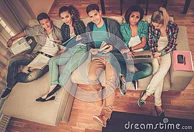 Young students preparing for exams in home interior Stock Photo