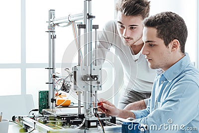 Young students using a 3D printer Stock Photo