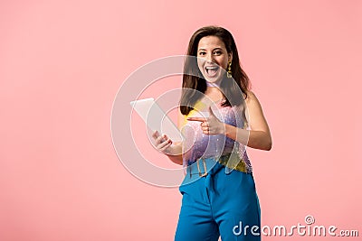 Young stylish disco girl pointing with Stock Photo