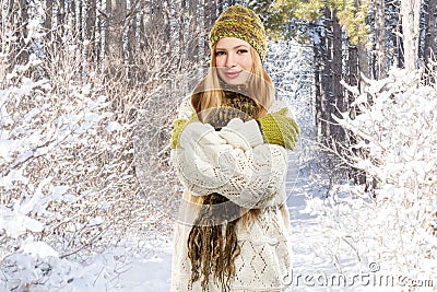 Young stylish smiling blonde woman in variegated melange knitted Stock Photo