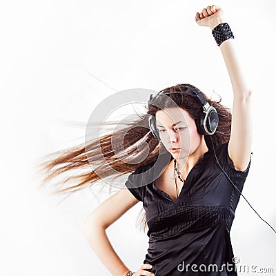 Young stylish woman in large headphones listening to music and having fun. Stock Photo