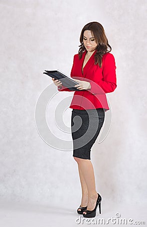 A young successful business lady in a classical costume. Stock Photo