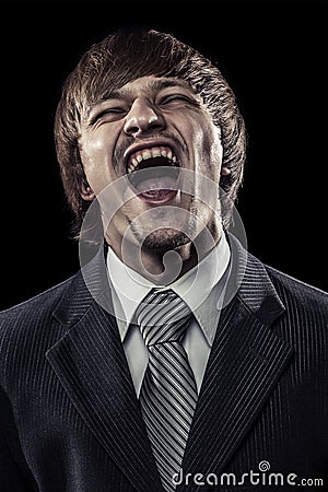 Young successful businessman laughing hard Stock Photo