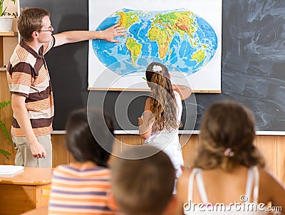 Young teacher at geography lesson Stock Photo