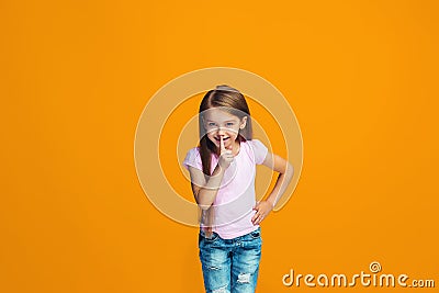 The young teen girl whispering a secret behind her hand Stock Photo