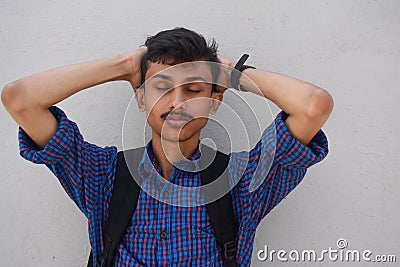 Young teen man suffering from strong headache and migrant decease.health care concept. Stock Photo