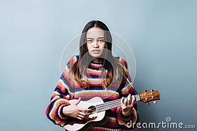 Frustrated Female Teen Trying to Learn and Instrument Stock Photo