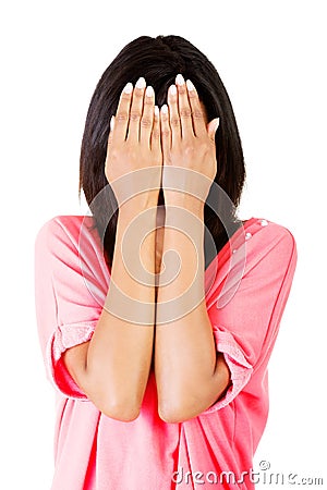 Young teen woman covering her face with hands Stock Photo