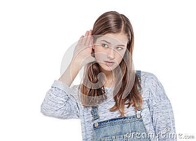 Young teenage fashion girl holds his hand near his ear and listening Stock Photo