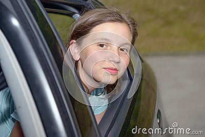 Young teenage girl sitting in a car Stock Photo