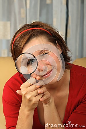 Young teenage holding a magnifying glass Stock Photo