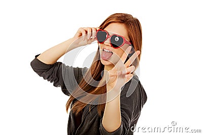 Young teenage woman wearing sunglasses Stock Photo