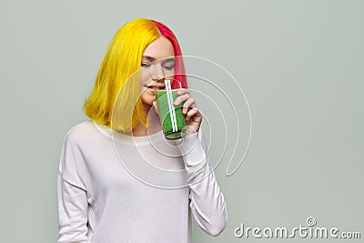 Young teenager girl with green vegetable smoothie drink, healthy vegan diet, copy space Stock Photo
