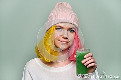 Young teenager girl with green vegetable smoothie drink Stock Photo