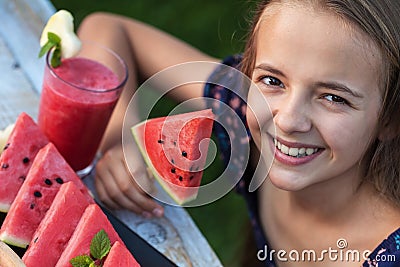 Young teenager girl having a healthy refreshing summer snack Stock Photo