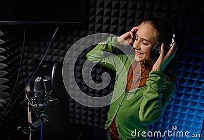 Young teenager girl singer at record studio Stock Photo