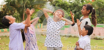 Young Teenagers group pointing fingers bullying to Caucasian - concept of racism, discrimination at school and outdoors Stock Photo