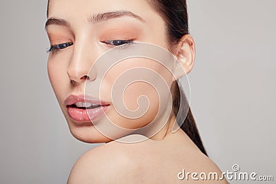 Young tender beautiful pretty girl with full lips with smile and a playful mood looking down with her mouth ajar Stock Photo