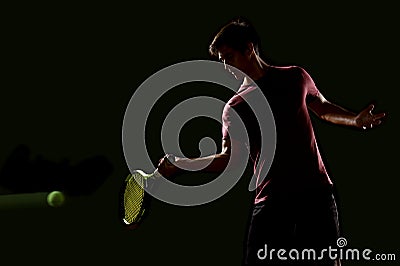 Young Tennis player ready to hit the ball Stock Photo