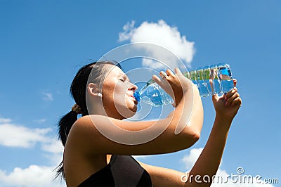 Young thirsty girl drinking water Stock Photo