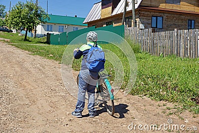 young tourist boy on a Bicycle travelling stopped looking forwar Editorial Stock Photo