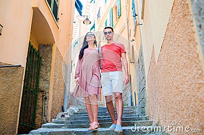 Young tourist couple traveling on european holidays outdoors in italian vacation in Cinque Terre Stock Photo