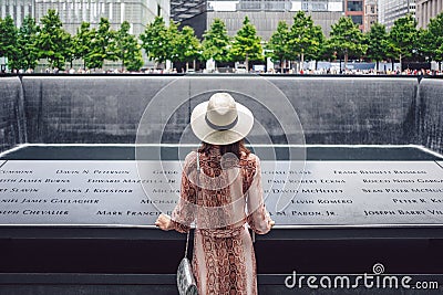 Young tourist at the 9/11 Memorial in New York Editorial Stock Photo