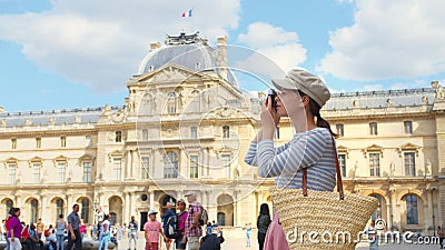 Young tourist with a retro camera in Paris Stock Photo