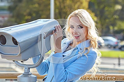 Young tourist using telescope tower observation deck i Stock Photo