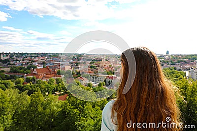 Young tourist woman looking to Vilnius city from panoramic point of view, Lithuania, Baltic States, Europe Stock Photo