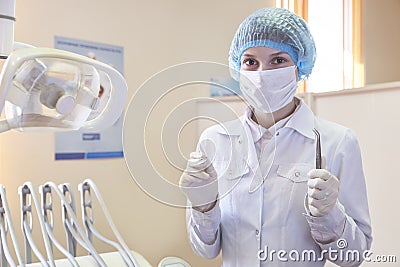 A young trainee doctor in white medical gown is studying dental. Stock Photo