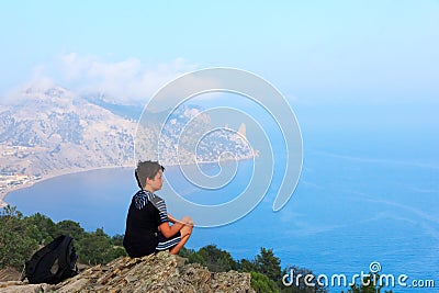 Young traveler at the mountain top Stock Photo