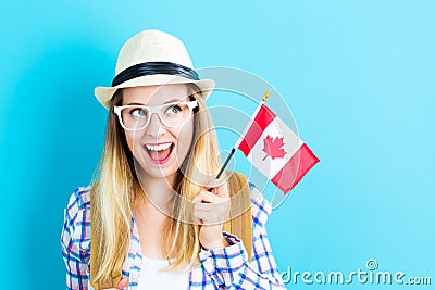 Young traveling woman holding Canadian flag Stock Photo