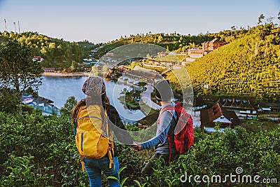 Couple Asian traveling together on mountain in Ban Rak Thai village countryside. Travel, camping in the winter, Outdoor relaxation Stock Photo