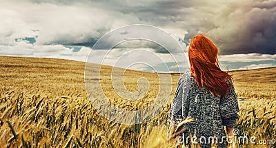 Young traveller standing back on plain field and breathtaking vi Stock Photo