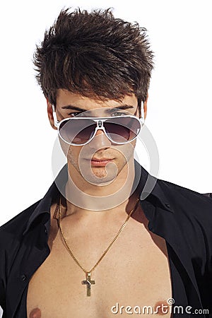 Young trendy guy. Italian man with big sunglasses and open black shirt Stock Photo