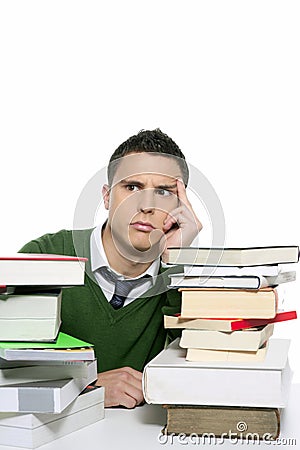 Young unhappy student with stacked books Stock Photo