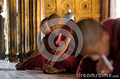 Young unidentified Buddhist monks learning in the Shwe Yan Pyay monastery school Editorial Stock Photo