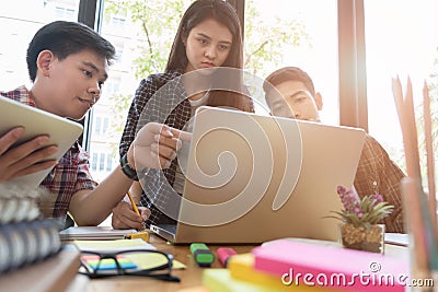 young university students studying with computer and tablet in c Stock Photo