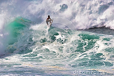 Barely visible surfer in the tube at Honolua Bay on Maui. Editorial Stock Photo